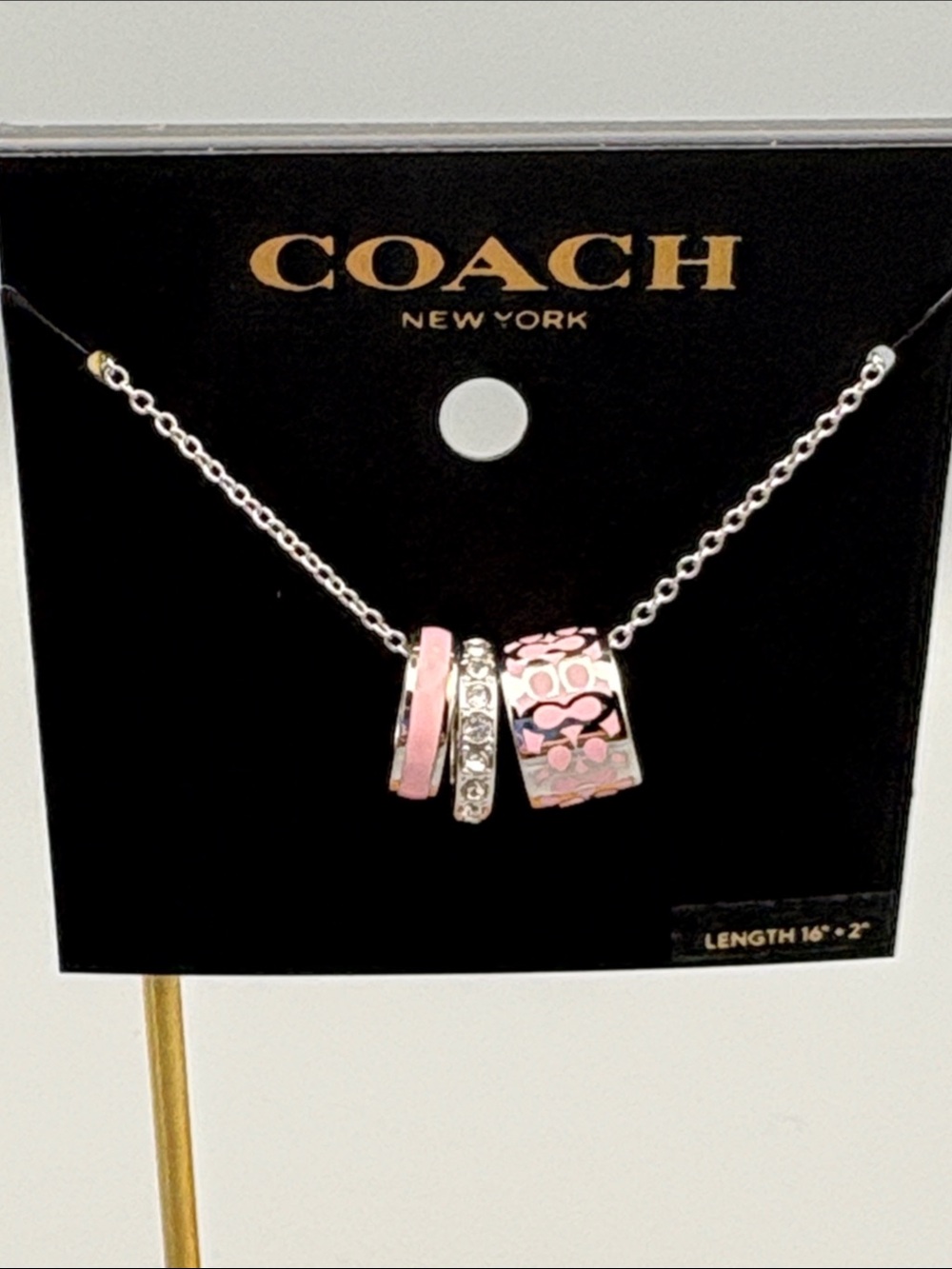COACH Pink and Silver Signature Ring Trio Necklace